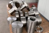 Machined titanium-like component blanks staged by geometry, showing why press capacity still needs part-family release evidence.