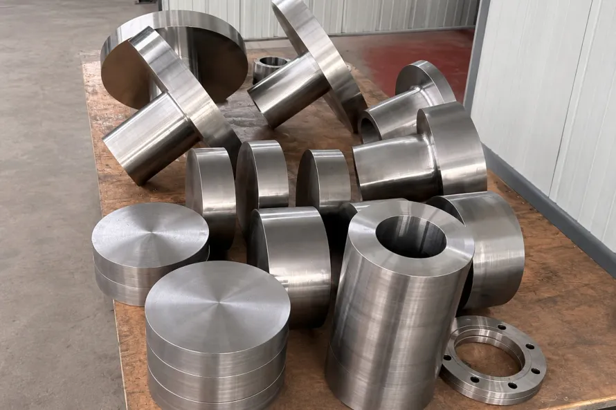 Machined titanium-like component blanks staged by geometry, showing why press capacity still needs part-family release evidence.