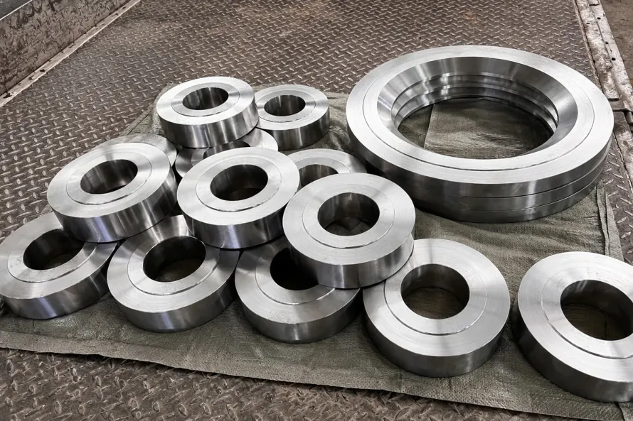 Machined ring blanks staged for inspection, showing why titanium forging supply must connect geometry, process route, and release records after a supplier change.