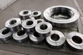 Machined titanium ring blanks grouped for shipment, illustrating why source control has to travel from strategic supplier decisions into lot-level release records.