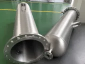 Cylindrical titanium shell components with flanged openings