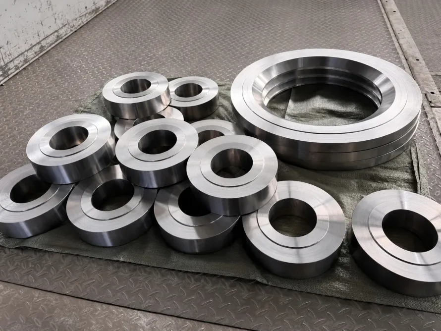 User-supplied machined titanium ring blanks represent released component geometry; they are not PBF specimens or fatigue-test evidence.
