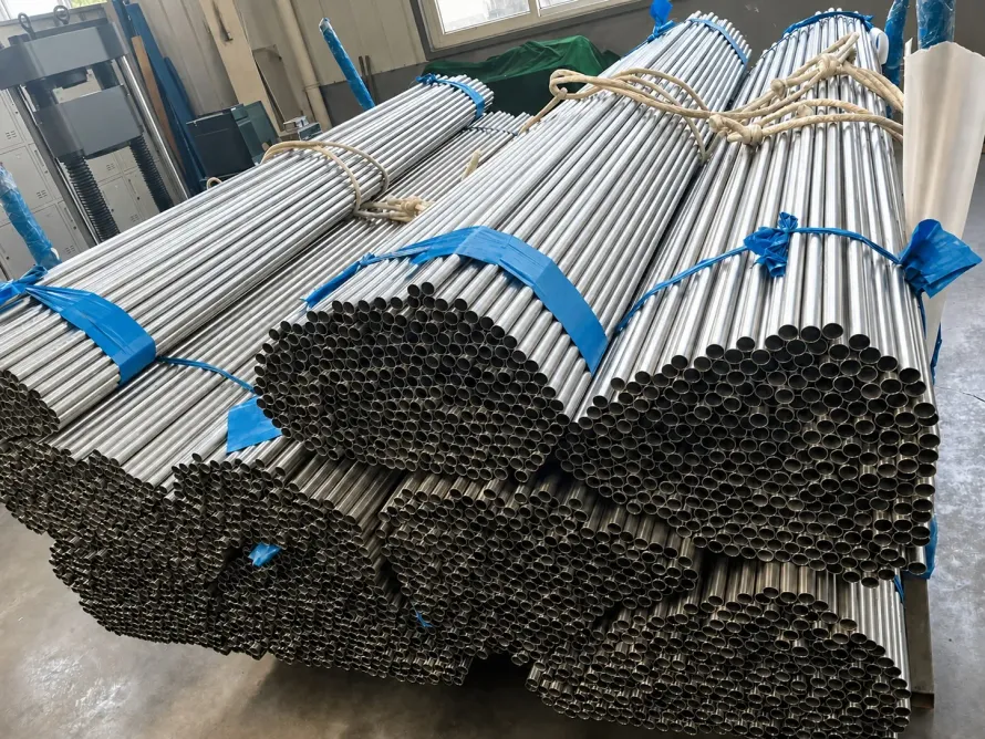 User-supplied titanium tube bundles represent the product form affected by hot-extrusion lubrication; they are not specimens from the study.