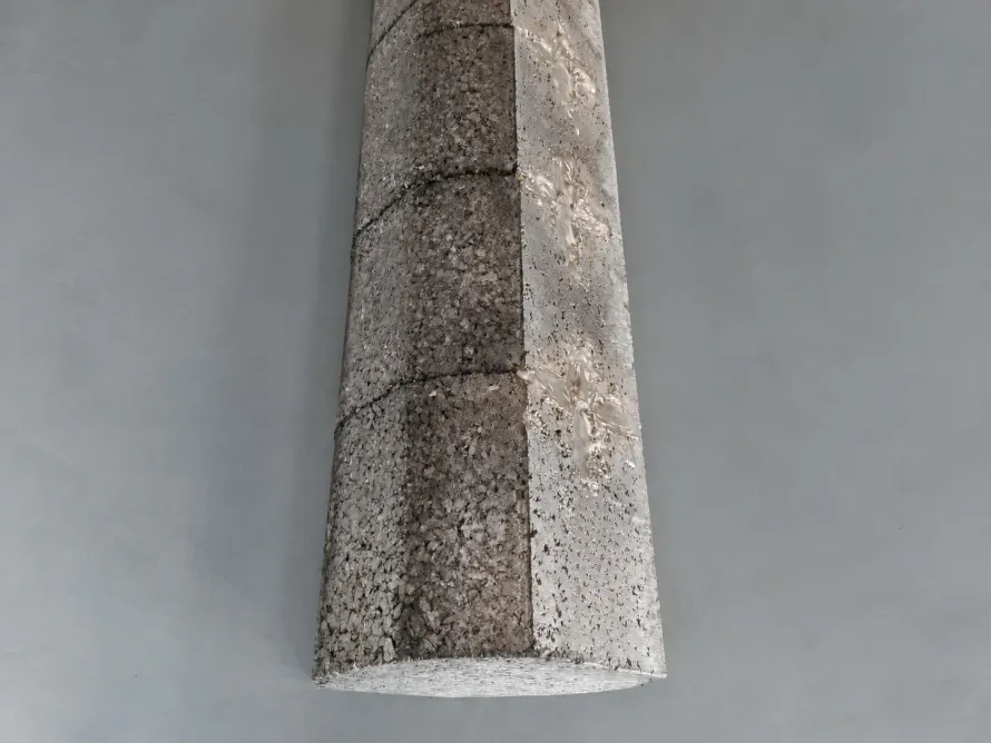 Side view of a rough segmented titanium-material compact