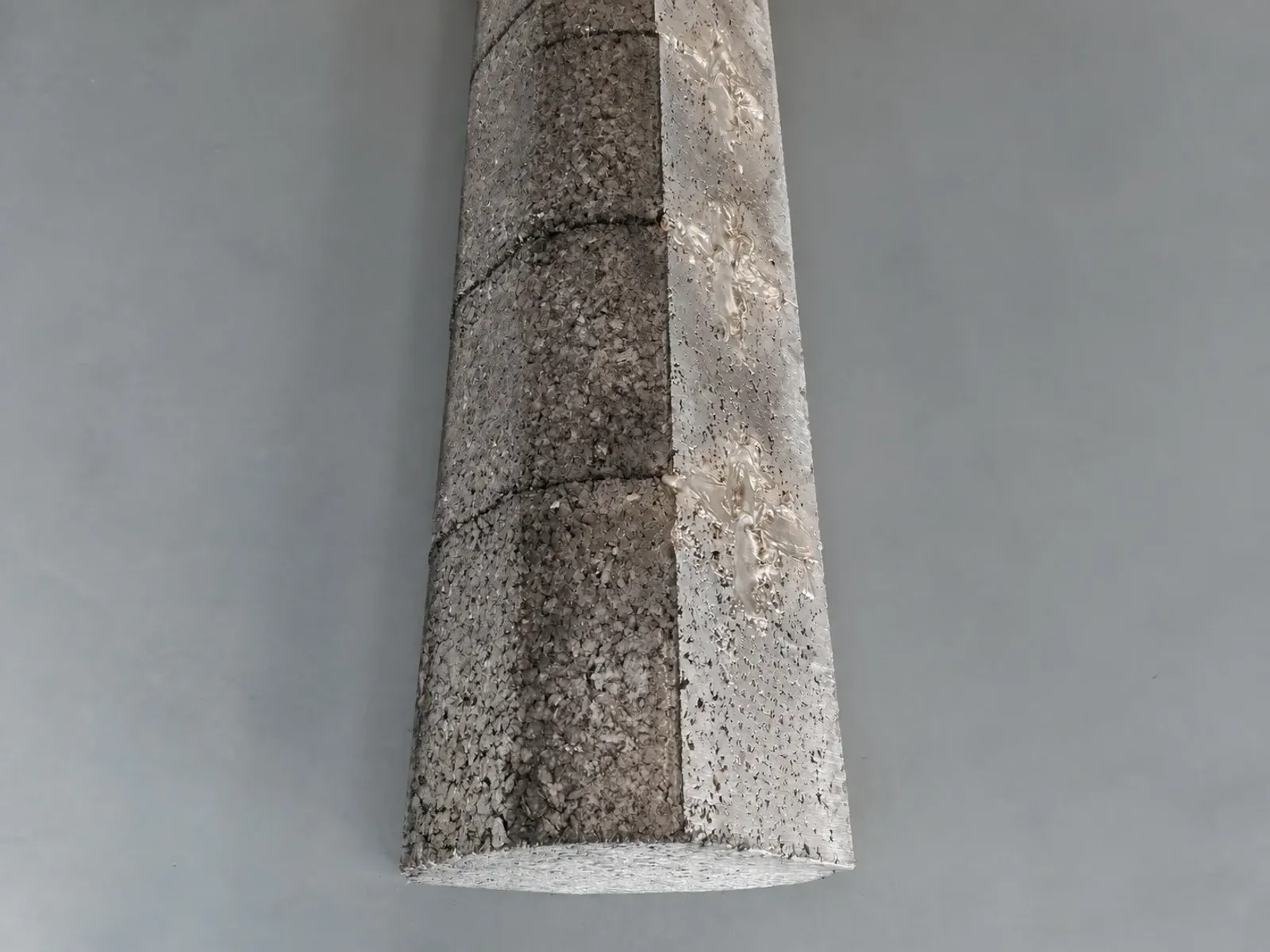 Side view of a rough segmented titanium-material compact