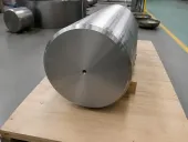 A representative large titanium billet illustrates upstream metal availability; it is not identified as material from any Farnborough exhibitor or aircraft program.