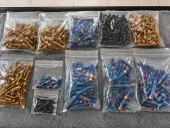 Assorted bolts with different surface appearances in clear sample bags