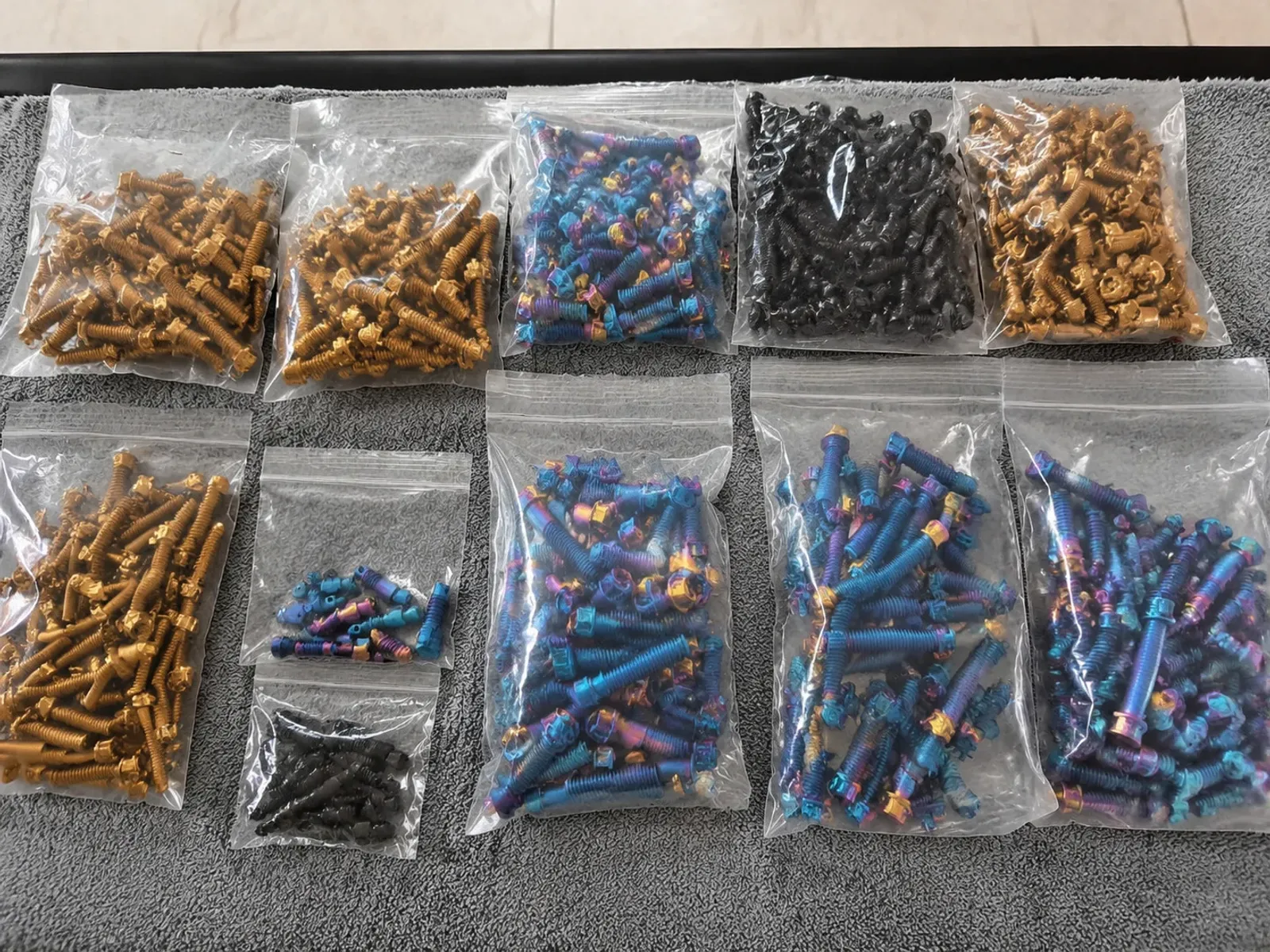 Assorted bolts with different surface appearances in clear sample bags