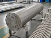 Titanium tube-sheet and heat-exchanger component in a clean workshop, showing why service environment and release evidence matter when buyers compare steel AM and titanium routes