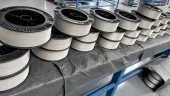 Metal wire on black plastic spools