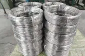 Titanium wire coils prepared for controlled feedstock handling, a reminder that wire-fed routes depend on batch identity, surface condition, storage and traceability before deposition begins.