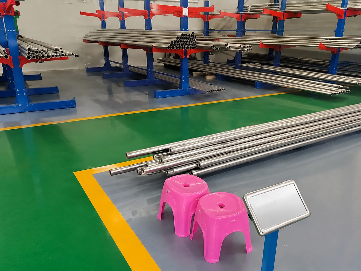 Titanium tube stock arranged by size in a clean warehouse setting, reinforcing that product-form boundaries remain separate from strategic supplier news