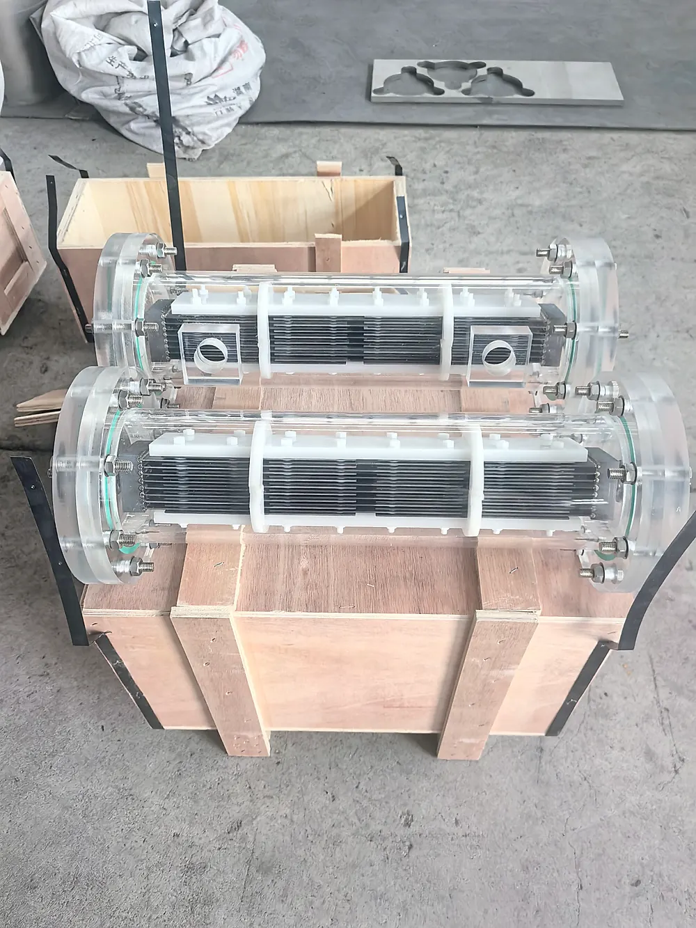 PEM titanium bipolar plate post-assembly with electrolyzer module, crated and ready to ship