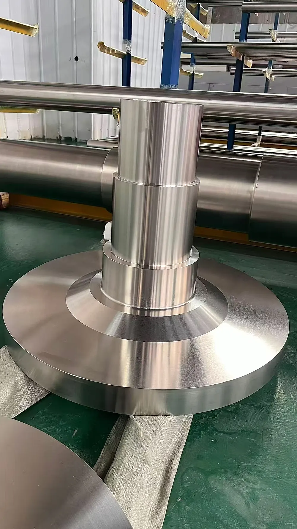 Large titanium pancake and shaft forgings, aerospace-grade Ti-6Al-4V billet close-up