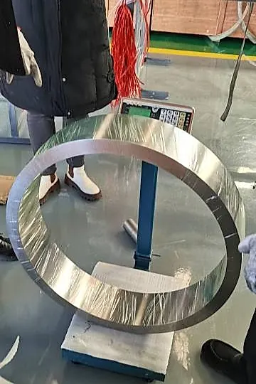 Titanium forged ring being weighed at factory floor during quality inspection