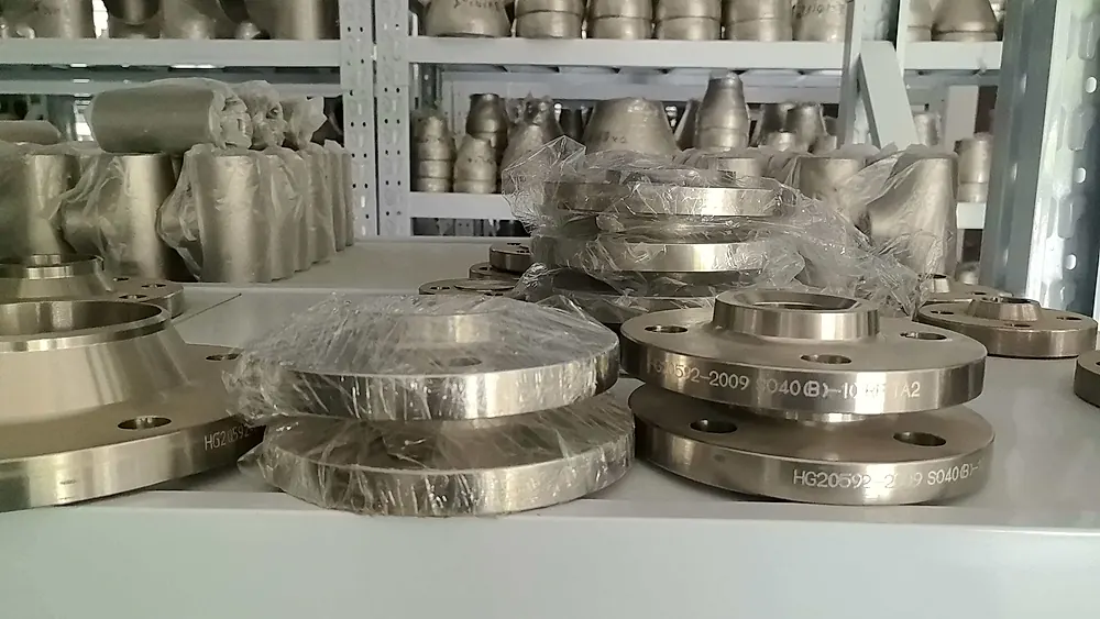 Gr.7 / Gr.12 titanium flanges and fittings — finished offshore seawater-grade inventory