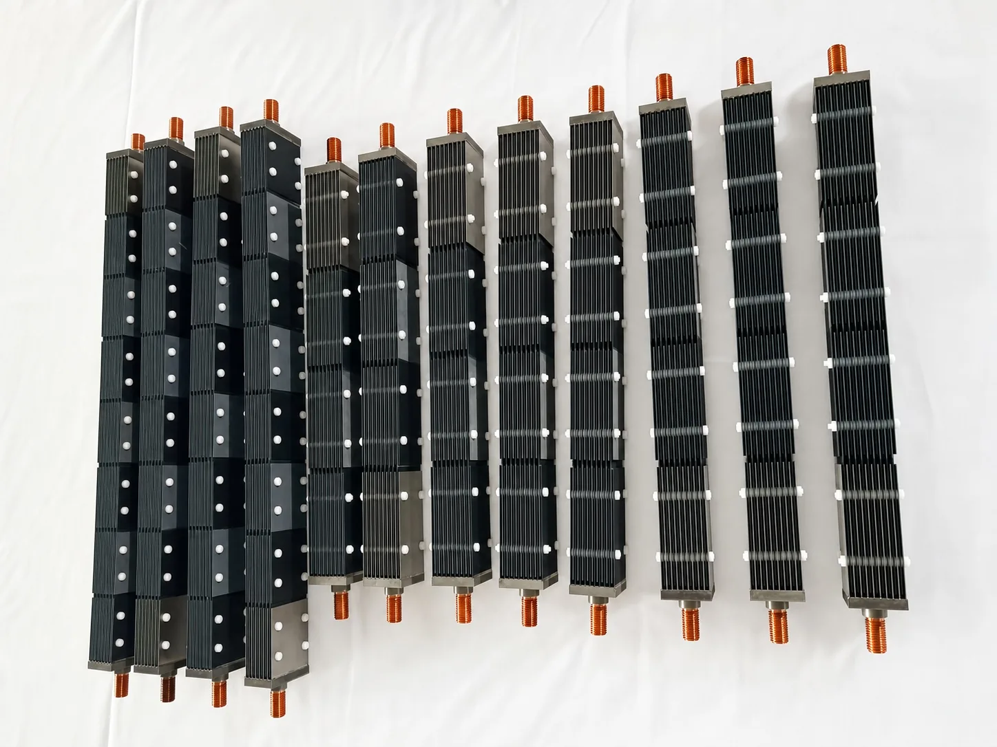 User-supplied coated titanium plate modules illustrate why coating continuity and substrate protection must be reviewed together; they are not PEMWE study specimens.