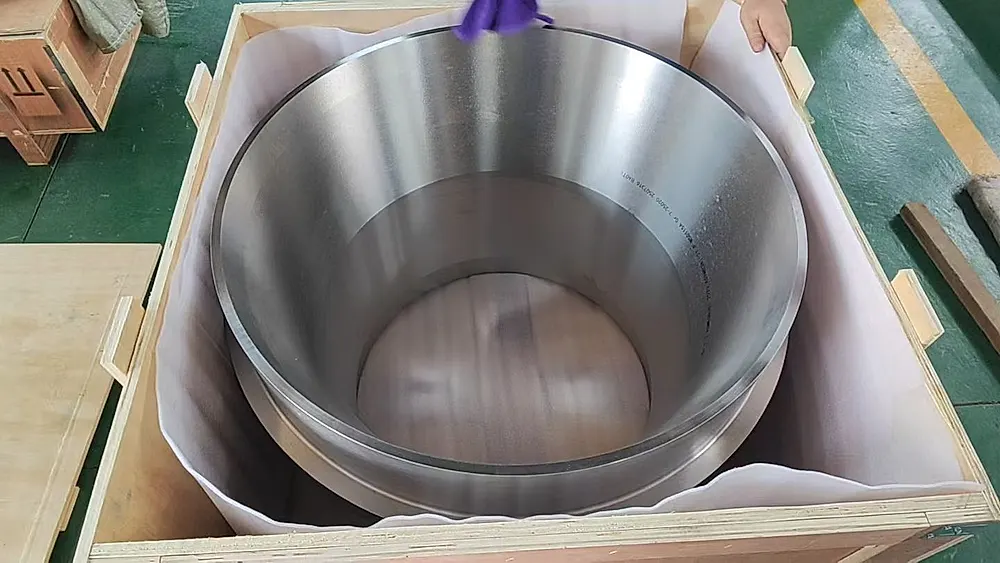 Large titanium pancake forging in export wooden crate with compliance labels, ready for shipment
