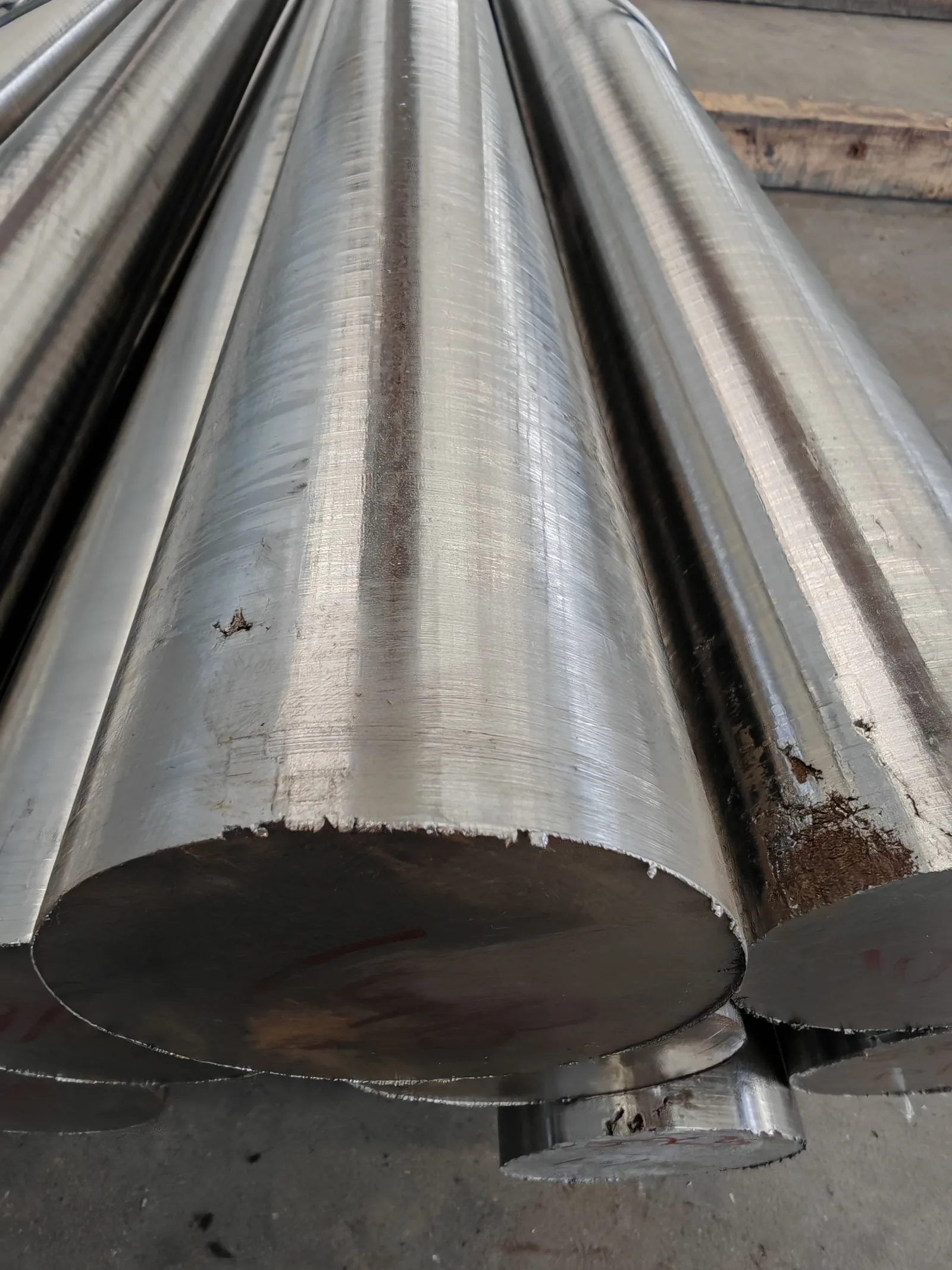 User-supplied titanium billet stock shows why a research chemistry must be translated into a controlled product form and process route; it is not study material.
