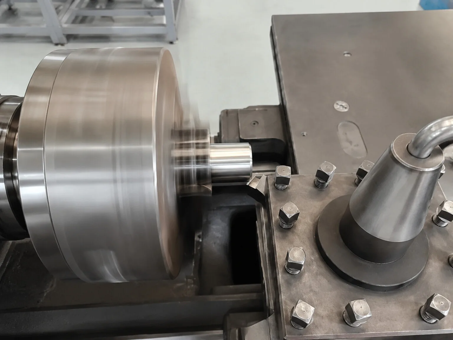 User-owned close-up of a conventional lathe cut illustrates tool-workpiece contact and surface generation; it does not show electrical or ultrasonic assistance.