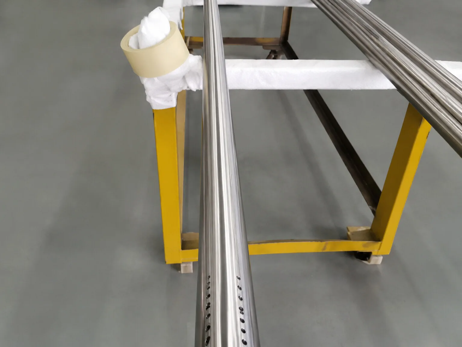 User-owned titanium-like precision stock illustrates the need to link material identity with inspection location; it is not LPBF powder or a study specimen.