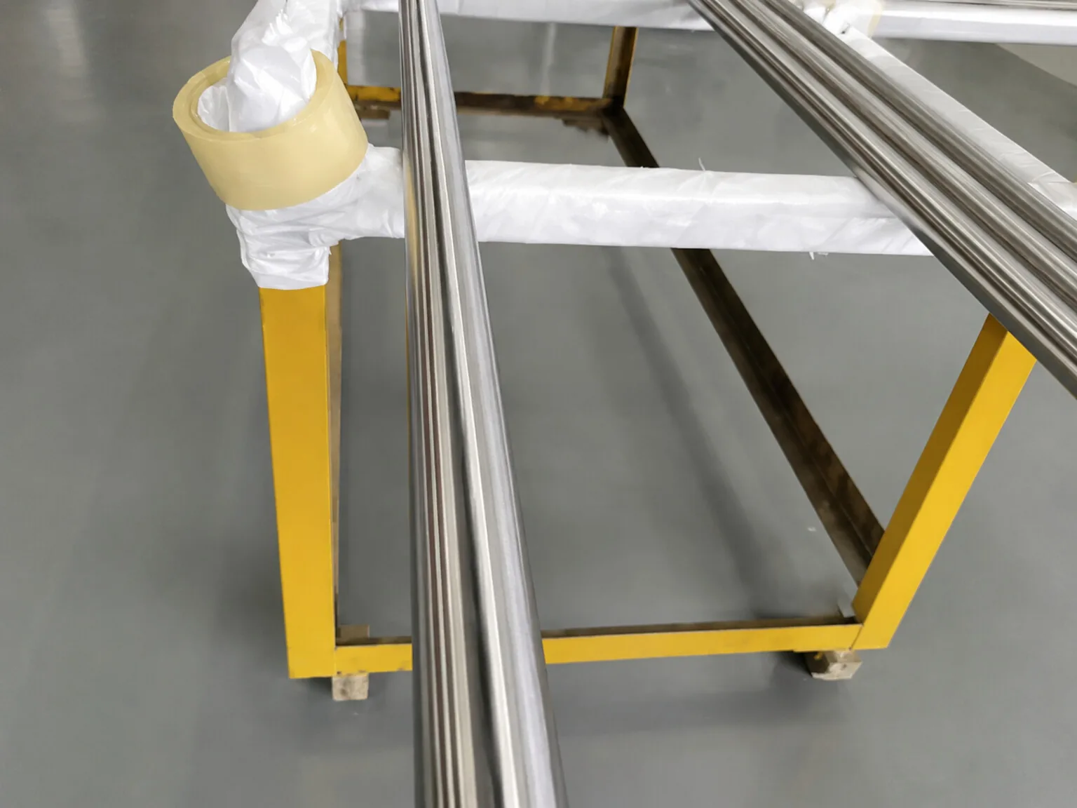 User-supplied titanium bars illustrate why a local material condition can matter beyond a heat-level certificate; they are not specimens from the study.
