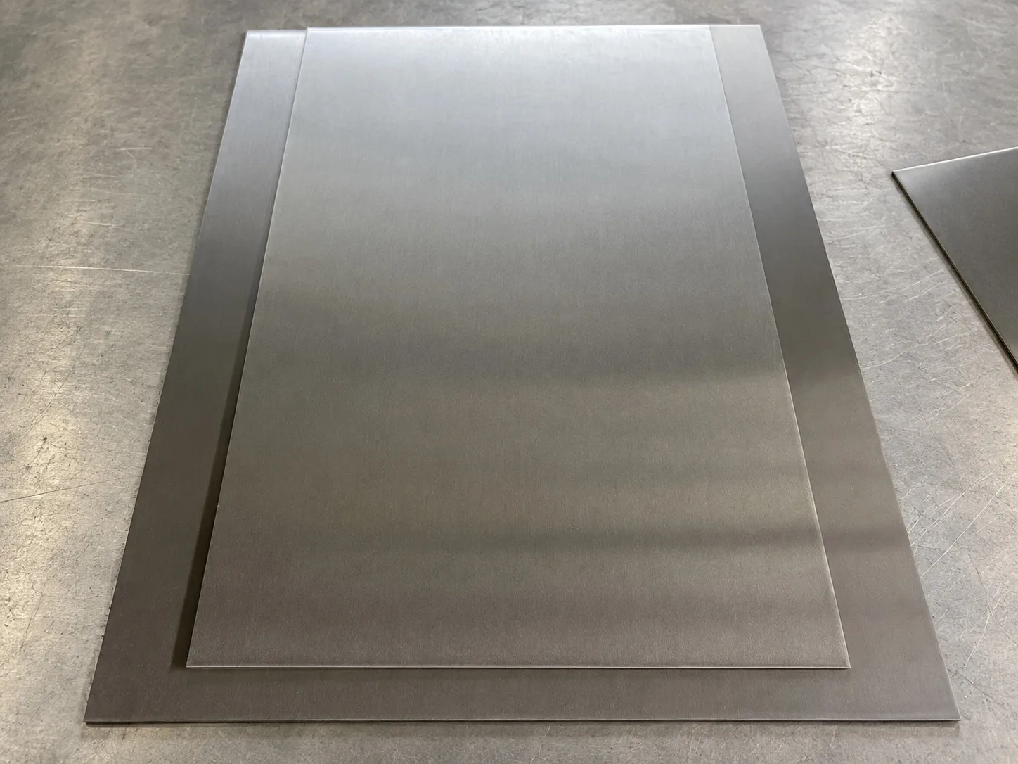 Stacked rectangular metal plates with uniform matte surfaces