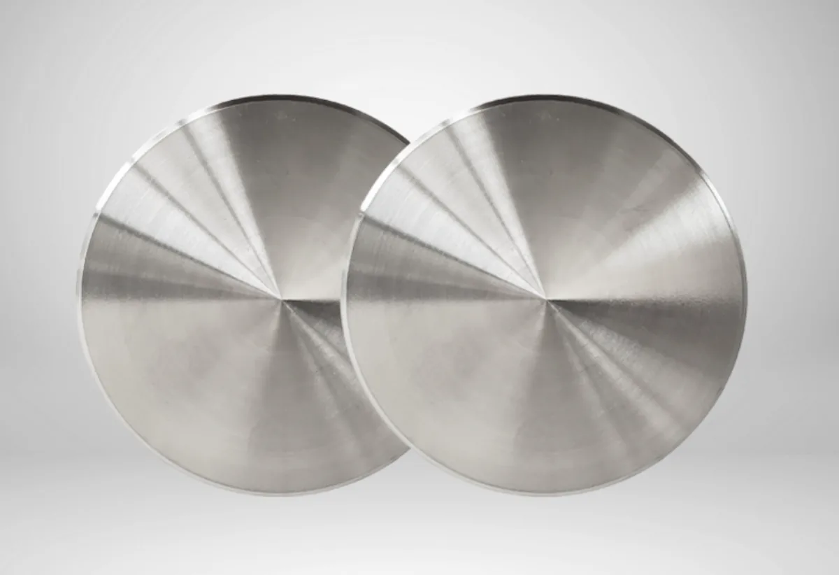 User-supplied machined titanium discs illustrate the importance of controlled surface and geometry; they are not Ti-bases or specimens from the study.