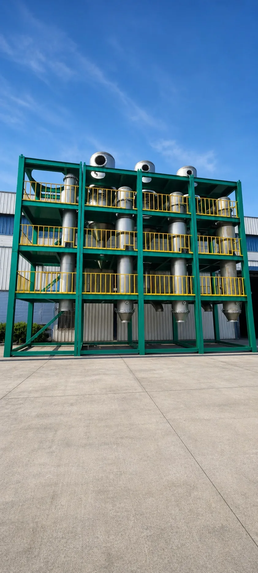 A user-supplied multi-stage titanium evaporator system illustrates industrial separation equipment; it is not the chlorinator or apparatus used in the cited study.