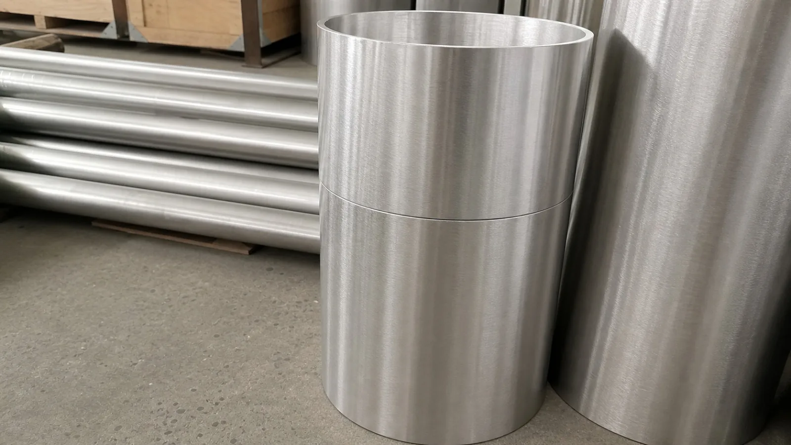 User-owned titanium pipe stock illustrates the product-form boundary for machining transfer; it is not a trial sample from the study.