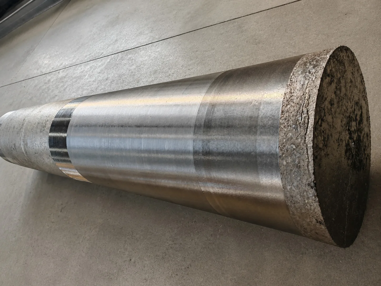 User-owned titanium billet surface illustrates the product-state boundary that a transfer review must define; it is not from the reported experiment.