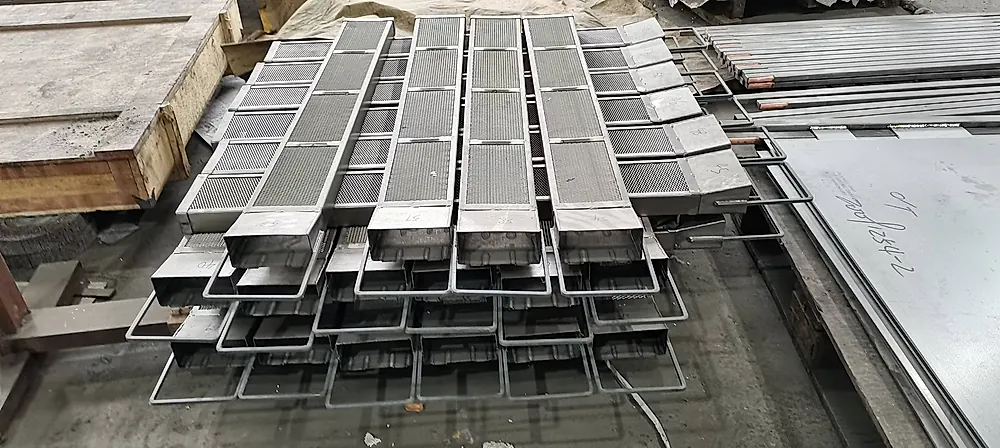Stack of titanium anode baskets with mesh panels