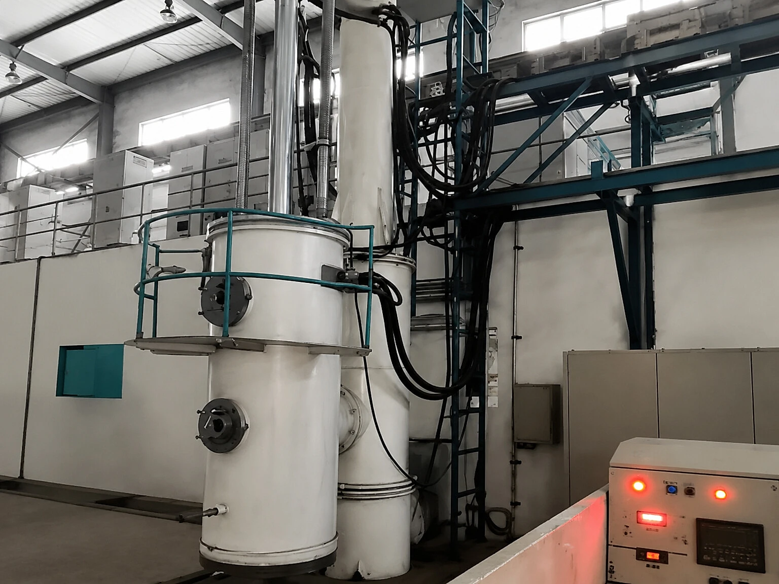 Vacuum and furnace equipment inside a titanium processing workshop, illustrating why powder capacity has to be connected to process control, safety review and release evidence