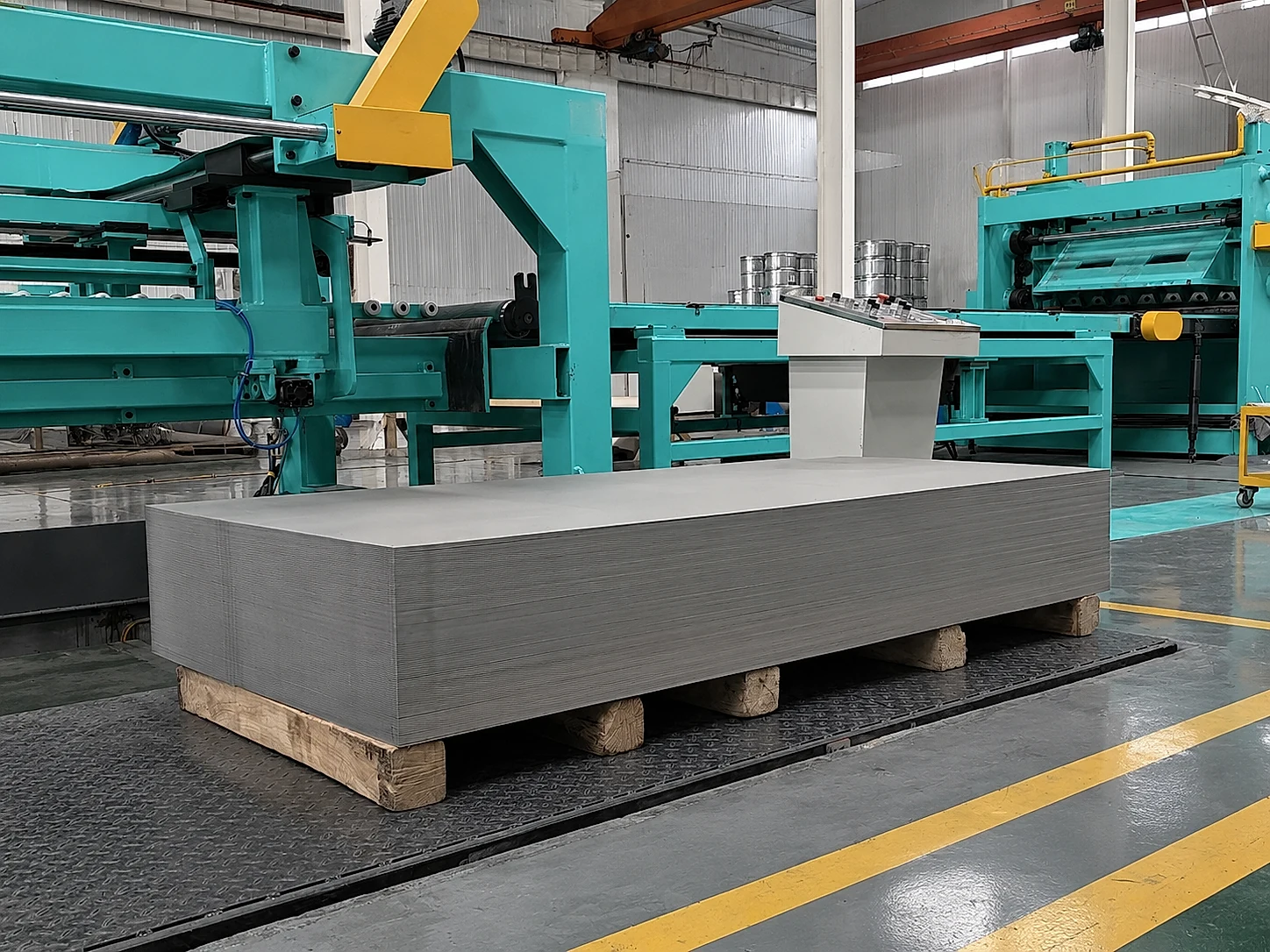 Titanium sheet stock positioned on processing equipment, illustrating how route control and capacity evidence become part of recurring supply