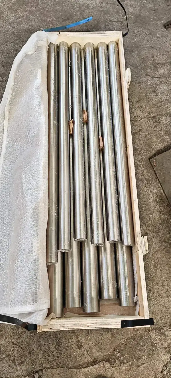 Titanium rods packed in wooden crate for shipping