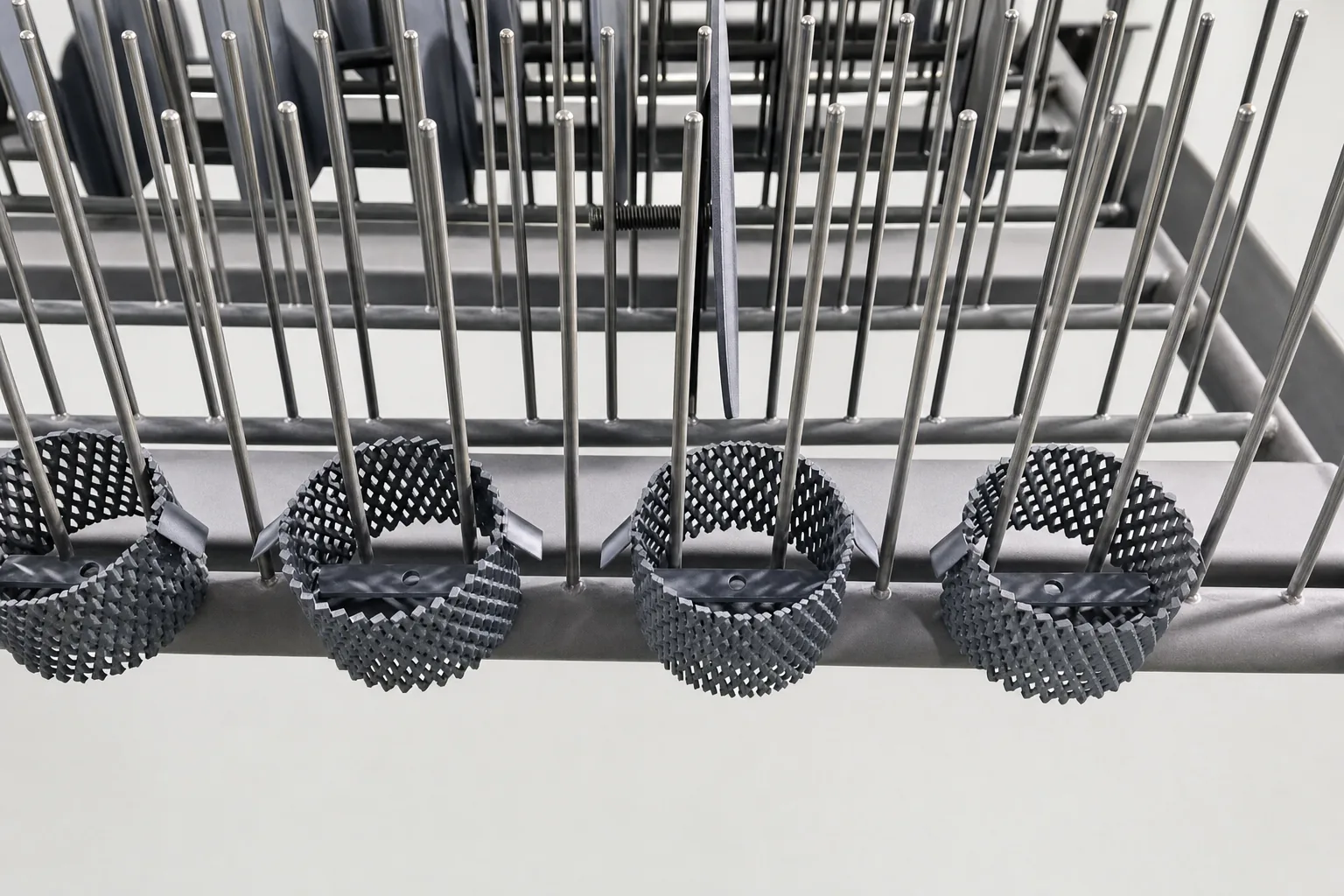 Close view of user-supplied fabricated titanium mesh supports the geometry-to-evidence discussion; it is an industrial component, not a medical device.