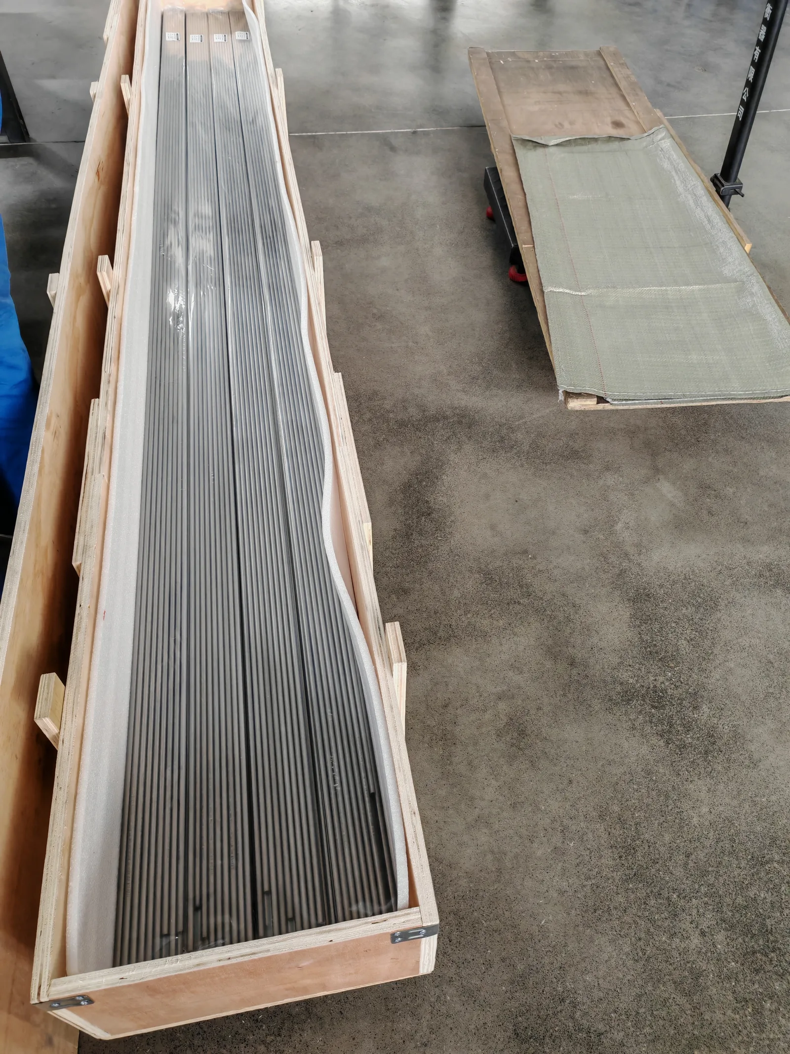 User-supplied packed titanium stock illustrates the controlled metallic input that must be separated from interlayer and collision-window acceptance.